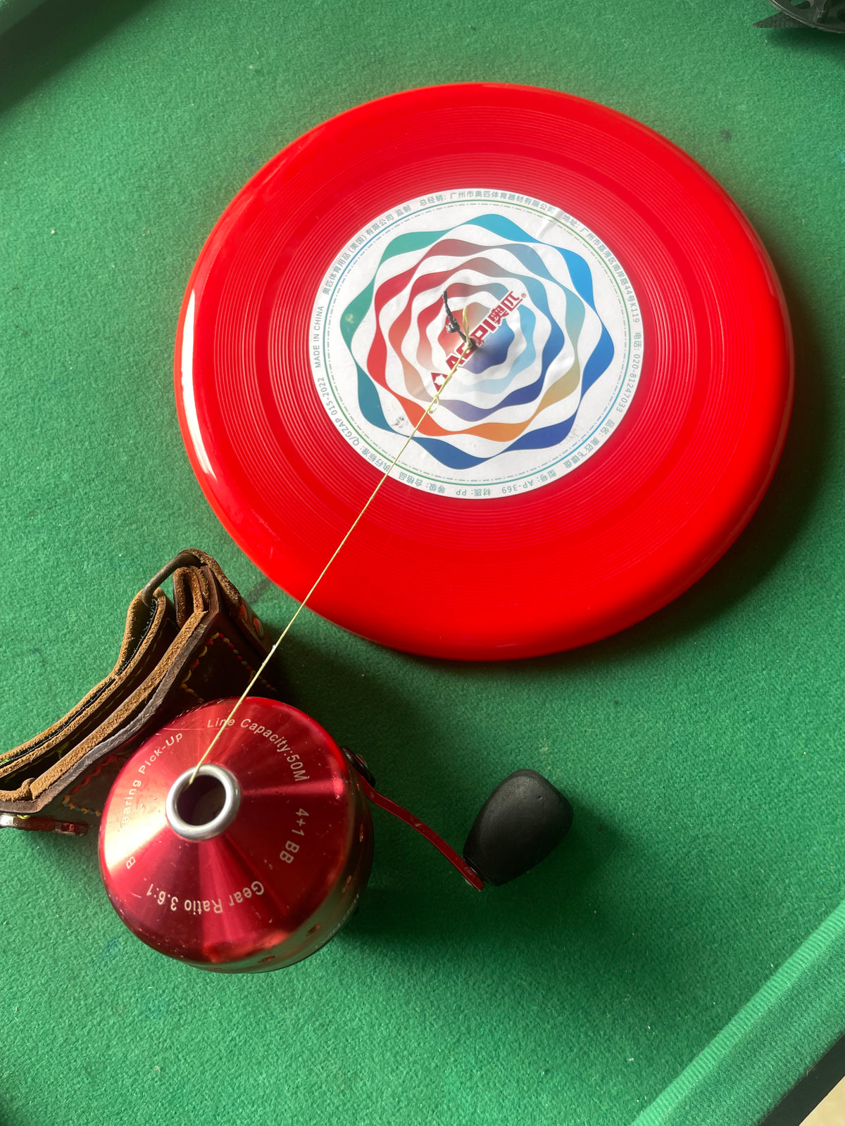 Flying disc fish wheel